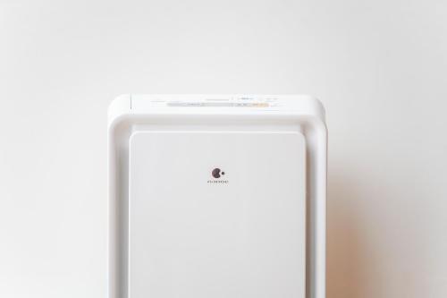 a white iphone with the apple logo on it at Hotel Sunroute Tokushima in Tokushima