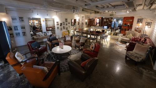 a room with chairs and a table in a store at Mini Hotel Causeway Bay in Hong Kong