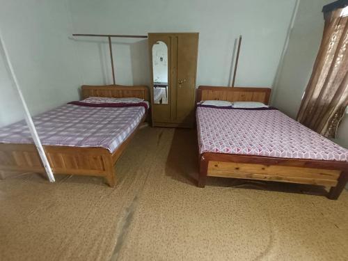 Postel nebo postele na pokoji v ubytování Ibankordor Jungle Resort