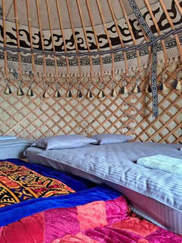 Voodi või voodid majutusasutuse Agat Yurt Camp toas