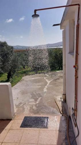 an outside view of a building with a window at Lake House in Yiannoulaíika