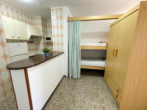 Una cocina o zona de cocina en Apartamentos Voramar 3000