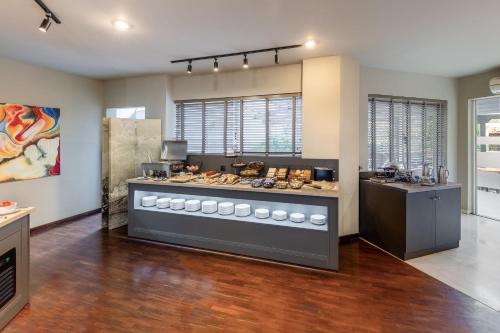 a kitchen with a counter with food on it at Hotel Nafpaktos in Nafpaktos