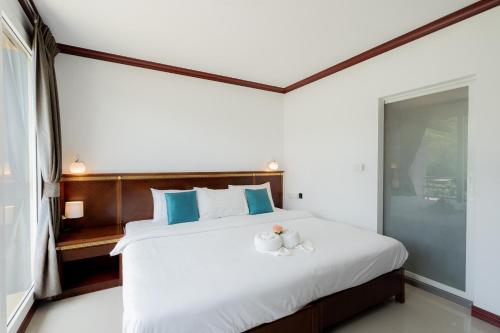 Ένα ή περισσότερα κρεβάτια σε δωμάτιο στο Hotel De Karon