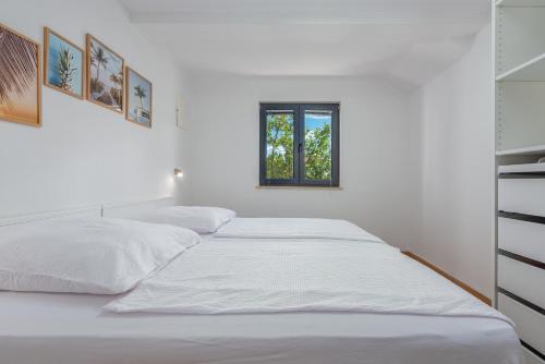 Postel nebo postele na pokoji v ubytování Bungalow-Vir-Zitna