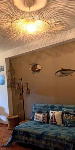 a bedroom with a bed with a ceiling at La Casa sulla Spiaggia in Marzamemi