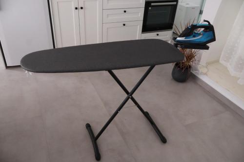 a black desk chair in a kitchen with at FOTEINI RESIDENCE in Kalymnos