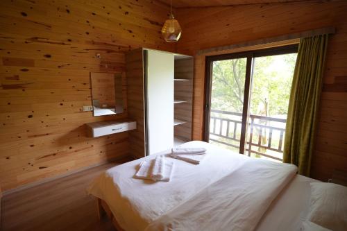 מיטה או מיטות בחדר ב-Cirali Villas 2