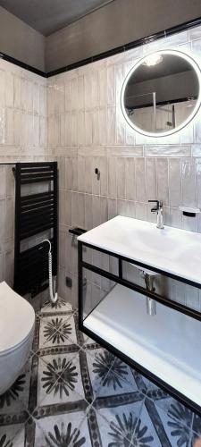 a bathroom with a sink and a toilet at Bunkr Karlštejn in Karlštejn