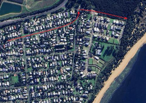 an aerial view of a city with houses and a road at The Endless Summer in Cape Woolamai
