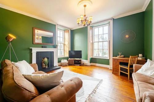 a living room with a couch and a fireplace at City Centre - 1 Bed - Sleeps 2 - Pet Friendly in Aberdeen