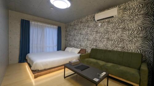 Letto o letti in una camera di 与那国むんぶステイ空港前