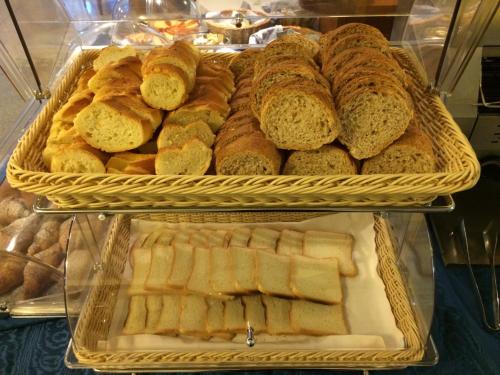 a display of bread and pastries in a bakery at Hotel Lario in Mezzegra