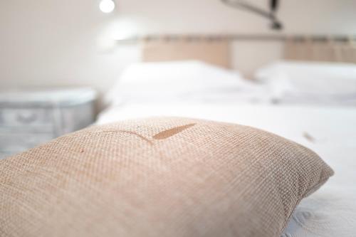 a close up of a pillow on a couch at Il risveglio del Poggio in Castiglione dʼOrcia