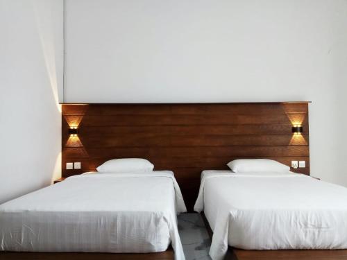 Katil atau katil-katil dalam bilik di Awandari Resort & Convention