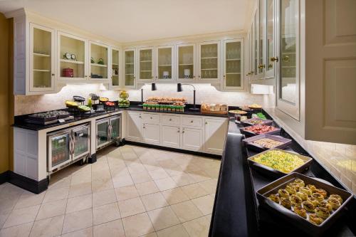a kitchen with a counter with food on it at Fairmont Copley Plaza in Boston