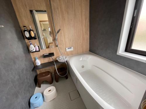 a bathroom with a white tub and a sink at Kisarazu - House - Vacation STAY 06328v in Kisarazu