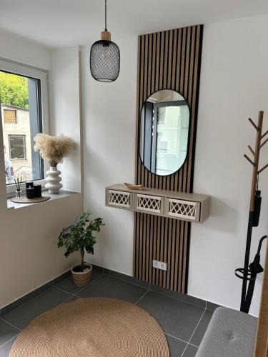 a room with a mirror on a wall at Ferienwohnungen Im Kimmelreich in Irsch