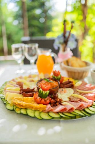a plate of food sitting on top of a table at Iris Hotel in Oradea