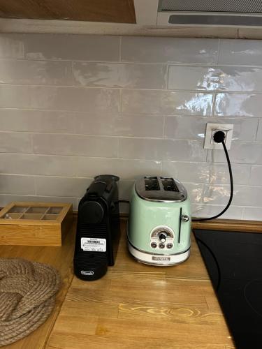 a toaster and a toaster sitting on a counter at Homefeel2024 in Kavala