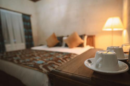 a hotel room with a coffee cup on a table at Hu of Cappadocia - Special Class in Uçhisar