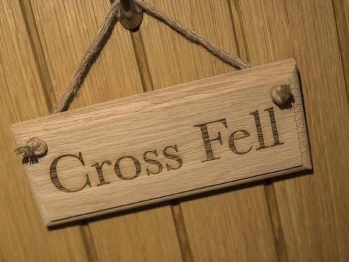 a sign that says cross felt hanging on a wall at New Crown Inn in Appleby