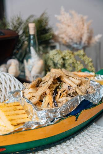 a plate of food on a table with food at Hotel Ponte Molo in Porto Tolle