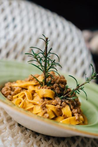 a plate of food with pasta on a table at Hotel Ponte Molo in Porto Tolle