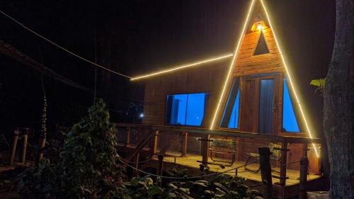 a church with a light on the front at night at Penginapan segitiga pangalengan in Riunggunung
