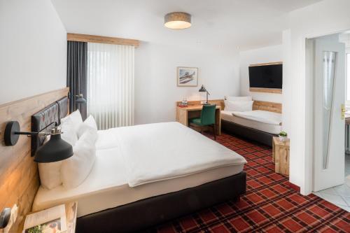 Postel nebo postele na pokoji v ubytování Hotel Kammerer