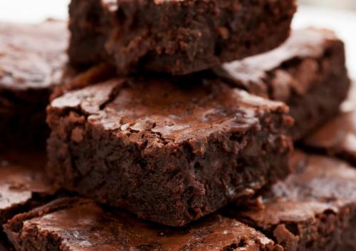 a pile of chocolate brownies sitting on a table at Firebrick Boutique Residences - GARNET HOUSE in Gurgaon