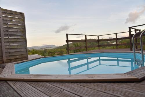 a pool on the deck of a house at Les Guettos 1&2. in Saint Esprit