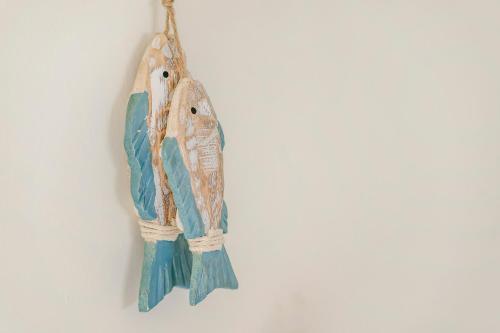 a fish hanging on a wall at Ocean Diary Hostel in Green Island