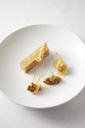 a white plate with a piece of food on it at Best Western Plus Hotel & Restaurant Les Humanistes Colmar Nord in Sélestat