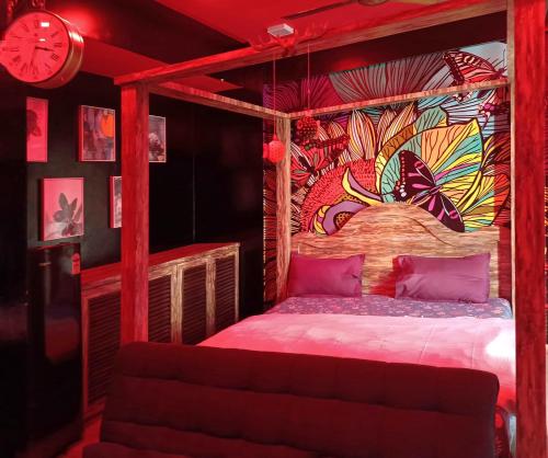 a bedroom with a canopy bed with a clock at The Nest Lucknow in Lucknow