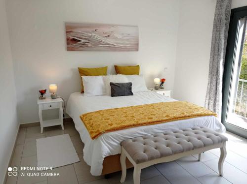 a bedroom with a large bed and a window at Ocean Suite - Villa Luar in Aljezur