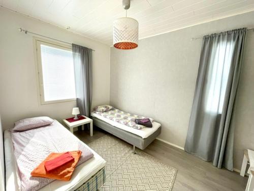 A bed or beds in a room at Apartment Isorannantie