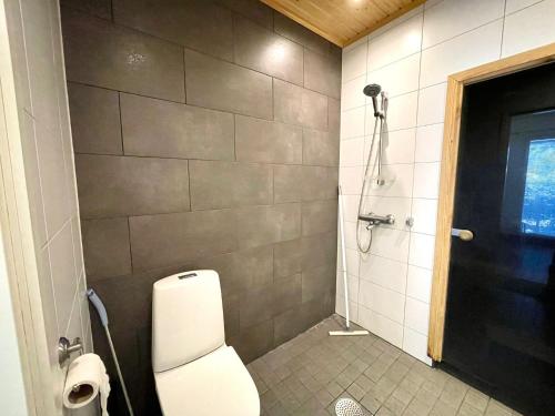 a bathroom with a toilet and a shower at Apartment Isorannantie in Pyhäjoki
