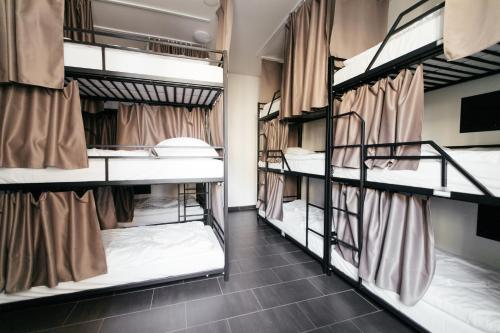 Posteľ alebo postele v izbe v ubytovaní Hostel Mandarinka