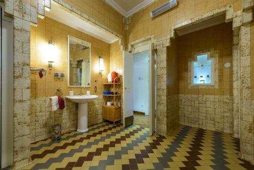 a bathroom with a sink and a mirror at Villa Mediteran Old Town, 5 En-Suites and Hot Tub in Dubrovnik