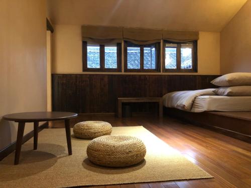 Ένα ή περισσότερα κρεβάτια σε δωμάτιο στο Eight Blessings Inn