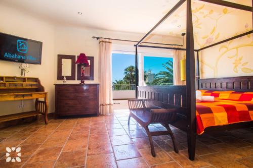 a bedroom with a bed and a dresser and a window at Villa Tuvalu by Abahana Luxe in Moraira