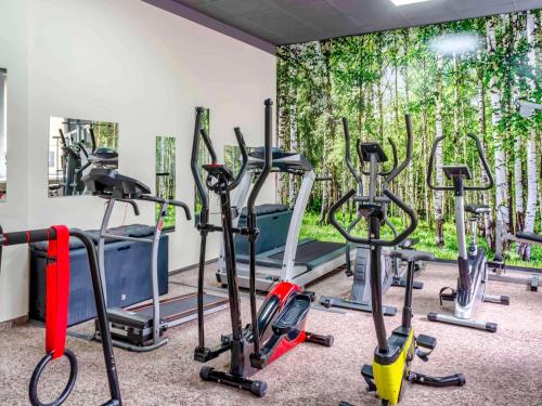 a gym with many exercise bikes in a room at Mercure Czestochowa Centrum in Częstochowa