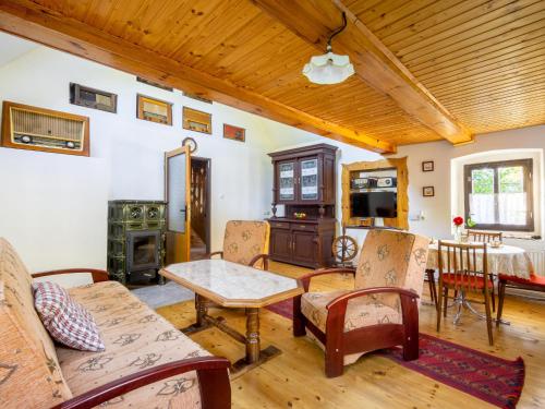 a living room filled with furniture and a wooden ceiling at Holiday Home Horní Prysk by Interhome in Liberec