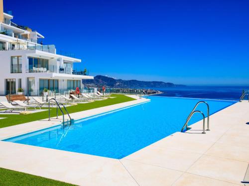 a swimming pool in front of a building at Apartment Bayview Hills by Interhome in Torrox Costa