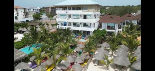 an aerial view of a resort with a swimming pool at SunSeaBar Beach Resort in Kendwa