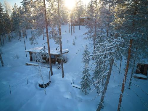 an aerial view of a cabin in the snow at Holiday Home Villa pirunpelto by Interhome in Kuopio