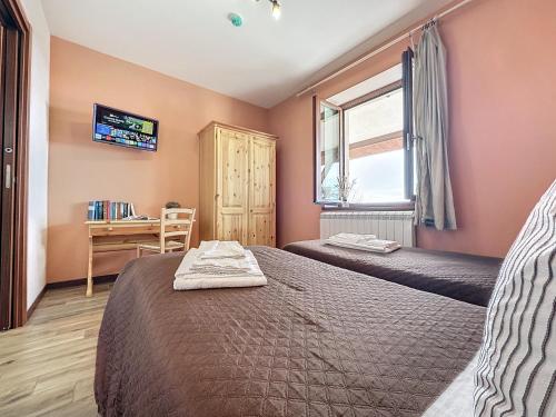 Katil atau katil-katil dalam bilik di Albergo Rifugio La Grande Baita