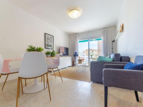 a living room with a couch and a table at Apartment Aries by Interhome in Cambrils