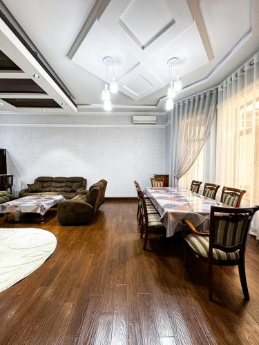 a dining room with a table and chairs at De Villa Hotel in Samarkand